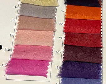 May include: A color chart of fabric swatches with numbers and letters. The swatches are arranged in rows and columns, and the colors range from white to black.