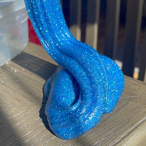 Holographic blue sparkly slime clear slime