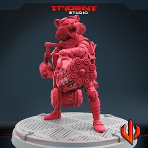 May include: A pink 3D printed figurine of a raccoon wearing a futuristic outfit and holding a large, detailed weapon. The figurine is standing on a circular base with a grid pattern.