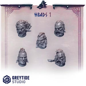 Puede incluir: Cinco cabezas en miniatura grises detalladas con expresiones de enojo se muestran sobre un fondo púrpura claro. El texto "HEADS 1" es visible. El logotipo de Greytide Studio está en la parte inferior.