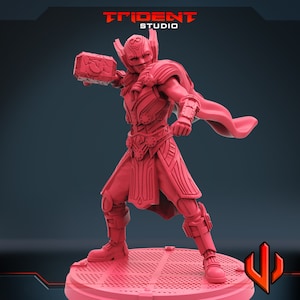 May include: A red plastic miniature figurine of a superhero holding a hammer. The figurine is wearing a helmet, armor, and a cape. The figurine is standing on a round base.