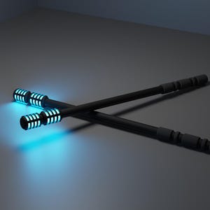 May include: Two black sticks arranged in an X shape, each featuring a cylindrical handle with a textured grip and a glowing cyan light emitting from a slotted section at one end, creating a bright blue illumination on the surrounding surface.