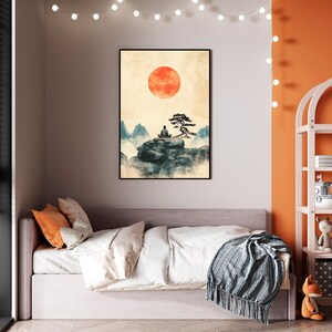 May include: A watercolor painting of a person meditating on a rock with a tree and a large red sun in the background. The painting is framed and hanging on a wall in a bedroom.