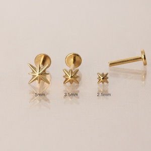 May include: Three gold star-shaped body jewellery pieces in different sizes: 5mm, 3.5mm, and 2.5mm. The jewellery is made of surgical steel and is suitable for piercings.
