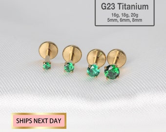 May include: Four titanium body jewelry pieces with green gem stones. The jewelry is available in three sizes: 5mm, 6mm, and 8mm. The jewelry is also available in three gauges: 16g, 18g, and 20g. G23 Titanium 16g, 18g, 20g 5mm, 6mm, 8mm