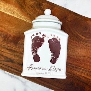 Custom urn for infant, stillborn, or child personalized with name, date and footprints