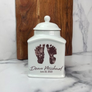 Custom urn for infant, stillborn, or child personalized with name, date and footprints