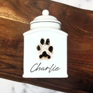 Custom pet urn. personalized modern urn for pet ashes. paw print on urn