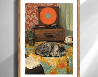 May include: A framed print depicts a cozy scene with a vintage record player, an orange vinyl record, and a sleeping tabby cat. A cup of coffee sits nearby. The cat rests on a yellow floral blanket, creating a warm, inviting atmosphere.