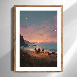 May include: A framed art print showing a beach scene at sunset. The artwork features a table with people, string lights, and a colourful sky with orange, blue, and purple hues. The frame is made of wood.