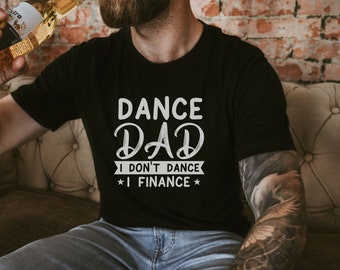 May include: A black t-shirt with white text that reads "Dance Dad I don't dance I finance".