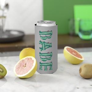 May include: Gray can cooler with a cactus design that spells out the word "BARE".