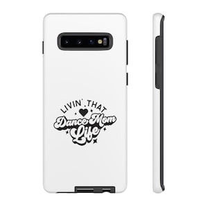 May include: White phone case with a black design that says "Livin' That Dance Mom Life" with a heart and stars.