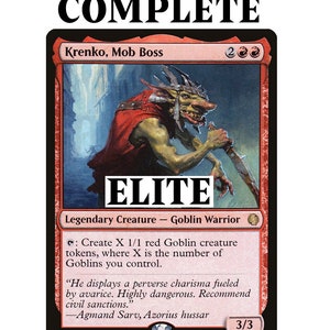 Może przedstawiać: Karta Magic: The Gathering z "Krenko, Mob Boss", Goblin Warrior. Karta jest w przeważającej mierze czerwona z ilustracją goblina trzymającego ostrze. Tekst zawiera "ELITE" i "READY-TO-PLAY 100-CARD DECK."