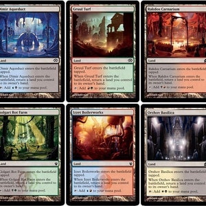 May include: Ten fantasy land cards from the Magic: The Gathering trading card game. Each card features a different color combination and depicts a unique landscape with buildings and structures. The cards are bordered in black and white with a white background.