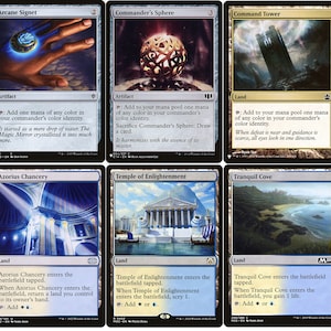 May include: A collection of ten Magic: The Gathering cards featuring various lands and artifacts. The cards are in a black border frame with a white background. The cards include Sol Ring, Arcane Signet, Commander's Sphere, Command Tower, Exotic Orchard, Azorius Signet, Azorius Chancery, Temple of Enlightenment, Tranquil Cove, and Azorius Guildgate.