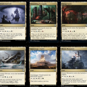 May include: A set of ten Magic: The Gathering cards featuring various land types, including Seaside Citadel, Arcane Sanctum, Crumbling Necropolis, Savage Lands, Jungle Shrine, Nomad Outpost, Frontier Bivouac, Sandsteppe Citadel, Mystic Monastery, and Opulent Palace.
