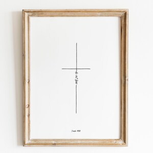 May include: A framed print with a simple black line drawing of a cross and the text "do not fear" and "Isaiah 41:10".