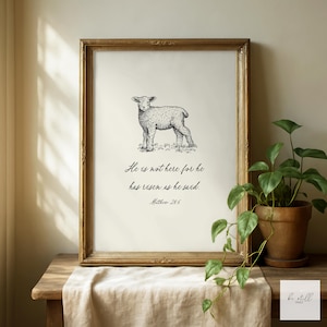 May include: A set of three ceramic mugs with a speckled, cream-colored glaze. Each mug features a different hand-painted design: a blue and green leaf, a yellow flower, and a red berry. The mugs have a simple, modern design.