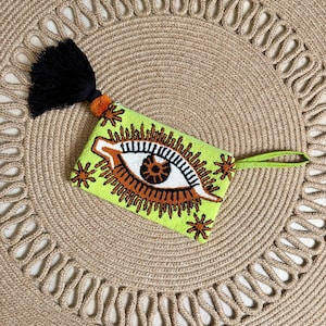 Cartera de mano Clutch wayuu tapizado Evil Eye ojo turco