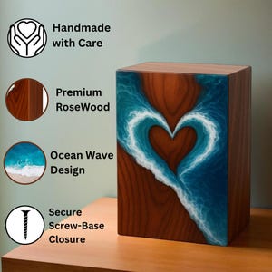 May include: A rectangular wooden box with a heart-shaped ocean wave design. The box is made of premium RoseWood and features a secure screw-base closure. The design includes the text "Handmade with Care" and "Ocean Wave Design".