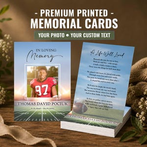 May include: Two rectangular memorial cards featuring a football theme. The left card displays a photo of a football player in a red jersey, the text IN LOVING MEMORY, THOMAS DAVID POCIUK, and dates. The right card shows a poem titled A Life Well Lived.