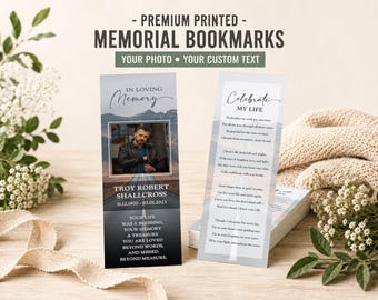 May include: Two rectangular memorial bookmarks featuring a road landscape background. One bookmark displays a photograph of a person, the name Troy Robert Shallcross, dates, and a poem. The other bookmark features the text Celebrate My Life and a poem.
