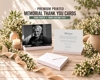May include: A stack of memorial thank you cards featuring a black and white portrait of a person on the front and a printed message on the back. The text reads PREMIUM PRINTED MEMORIAL THANK YOU CARDS, YOUR PHOTO, YOUR CUSTOM TEXT, and Thank you.