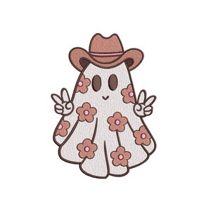 May include: An embroidered ghost wearing a brown cowboy hat and giving the peace sign. The ghost is white with brown eyes and a smiling mouth. It is decorated with pink and brown flowers.