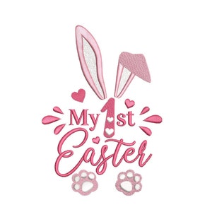 May include: Pink bunny ears with white lining, two pink hearts, and the text "My 1st Easter" in pink with two white hearts. Two white paw prints are below the text.