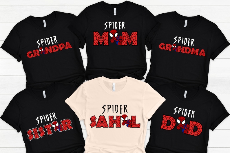 May include: Six black t-shirts with red and white spider-man themed designs. The shirts have the text "Spider Mom", "Spider Dad", "Spider Grandma", "Spider Grandpa", "Spider Sister", and "Spider Sahl" printed on them.