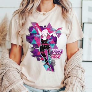 May include: A set of three ceramic mugs with a speckled, matte finish. The mugs are in shades of cream, light gray, and dark gray. Each mug has a simple, minimalist design and a rounded handle.