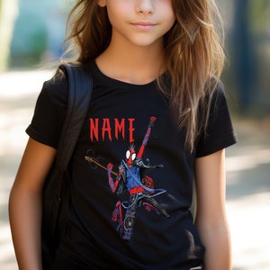 May include: Black t-shirt with a graphic of Spider-Man playing a guitar. The text "NAME" is printed above the graphic.