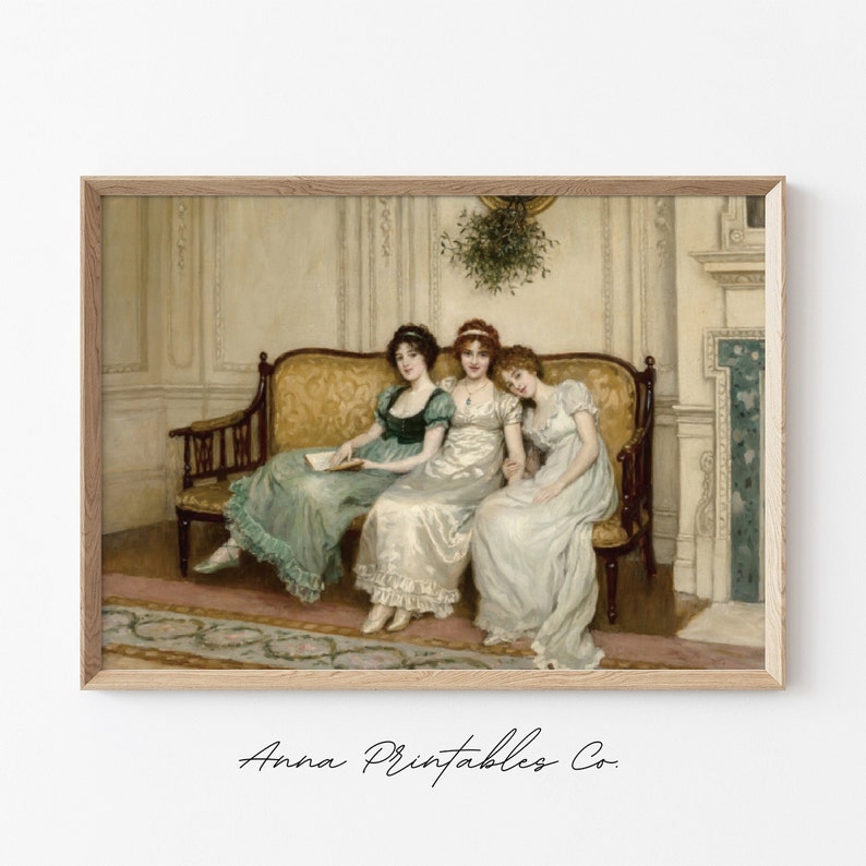 May include: Three women in elegant dresses sit on a gold and brown sofa in a room with white walls and a fireplace. The women are wearing green, white, and white dresses. The woman in the middle is wearing a necklace. There is a sprig of mistletoe hanging above the sofa.