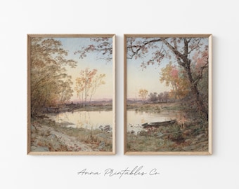 May include: A pair of framed watercolor paintings depicting a tranquil river scene with trees and a boat. The paintings are in a light wood frame and have a vintage aesthetic.