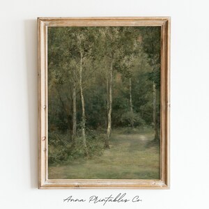 May include: A framed painting of a forest scene with tall trees and a path leading into the woods. The painting is done in a muted green and brown color palette, giving it a vintage feel.