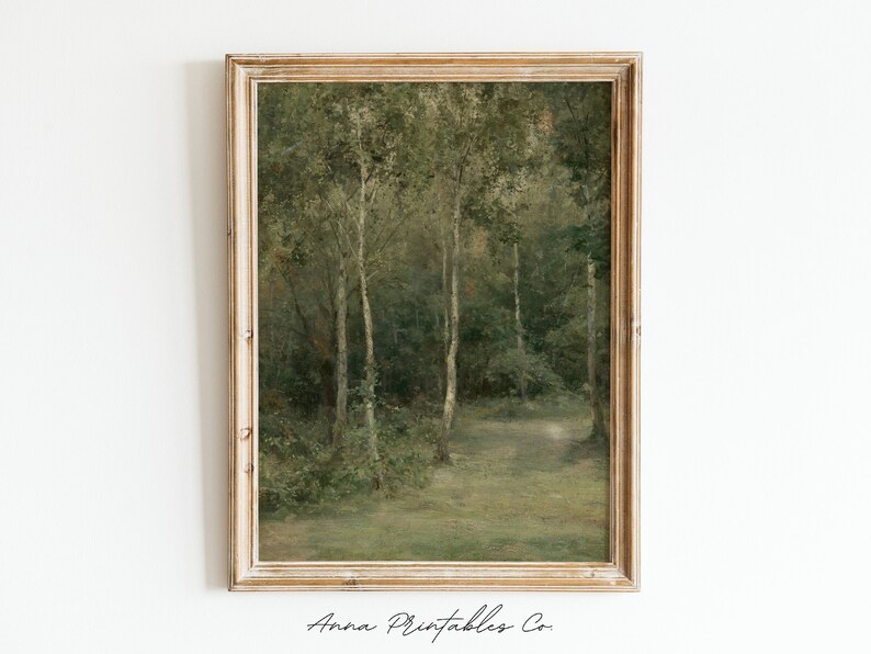 May include: A framed painting of a forest scene with tall trees and a path leading into the woods. The painting is done in a muted green and brown color palette, giving it a vintage feel.