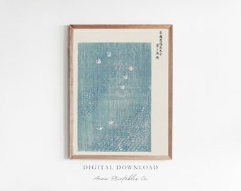May include: A blue and white Japanese woodblock print with the text "市原春海 天文 中" in black. The print depicts a blue sky with white clouds and a mountain range in the background.