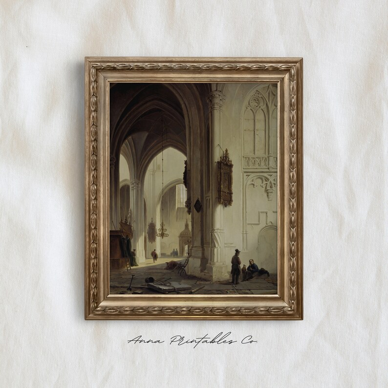 May include: A framed painting depicting the interior of a church with high vaulted ceilings and arched doorways. The painting is in a gold frame and features a group of people standing in the church.