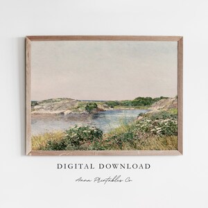 May include: A digital download of a watercolor painting depicting a tranquil landscape with a small body of water surrounded by lush greenery and rocky shores.