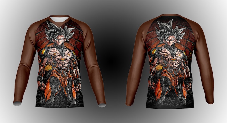 May include: A brown long-sleeve shirt with a black and orange graphic print of a character with spiky black hair. The character is wearing a black and orange suit with a yellow belt.