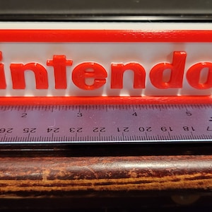 Nintendo Logo Delight - A Nostalgic Tribute for Gamers of All Eras