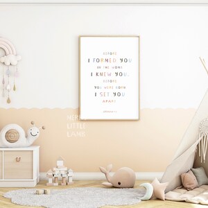 May include: A nursery room with a white teepee tent, a rainbow mobile, a wooden dollhouse, and a framed print with the text "Before I formed you in the womb I knew you. Before you were born I set you apart."