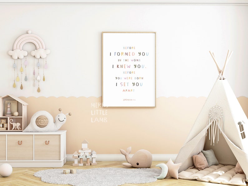 May include: A nursery room with a white teepee tent, a rainbow mobile, a wooden dollhouse, and a framed print with the text "Before I formed you in the womb I knew you. Before you were born I set you apart."