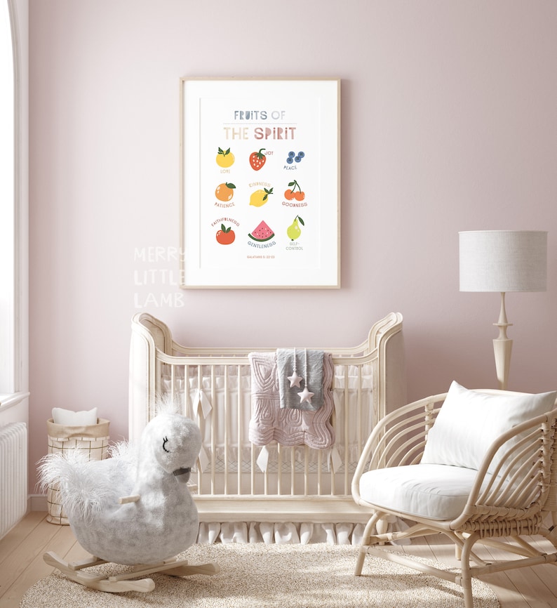 May include: A nursery room with a white crib, a rocking horse, a wicker chair, and a framed print with the text "Fruits of the Spirit" and illustrations of fruit. The print lists the fruits of the spirit: love, joy, peace, patience, kindness, goodness, faithfulness, gentleness, and self-control.