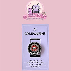 May include: A pin featuring the text "COGSUCKER" and a graphic of red lips and a gear. The pin is displayed on a card with the text "AI COMPANPINS" and "BECAUSE MY BOYFRIEND IS BETA THAN YOURS!" The background is pink.
