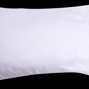 May include: A white pillowcase with a smooth, wrinkle-free surface. The pillowcase is made of a soft, comfortable fabric.