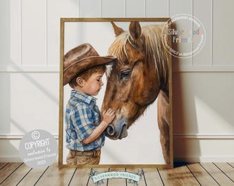 May include: A watercolour painting of a young boy wearing a brown cowboy hat and a blue plaid shirt, gently touching the nose of a brown horse. The painting is framed in a light brown wood frame.