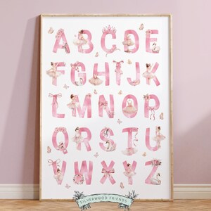 May include: Pink alphabet poster with ballerina illustrations for each letter. The letters are pink and the ballerinas are wearing pink tutus and white shoes. The poster has a white background and the text "SILVERWOOD FRIENDS" at the bottom.