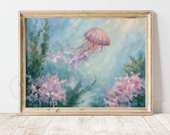 May include: A framed painting depicting a pink jellyfish swimming through blue water with green seaweed and pink coral clusters. The artwork features soft brushstrokes and light textures, presented in a light-toned wooden frame.